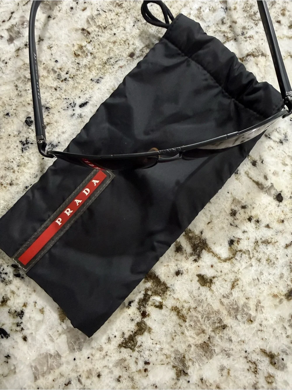 Prada Black Frame Sunglasses with Dark Lenses